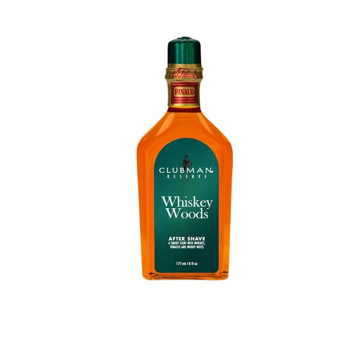 A 6-ounce bottle of Clubman Reserve Whiskey Woods After Shave Lotion featuring its whisky-colored liquid contents