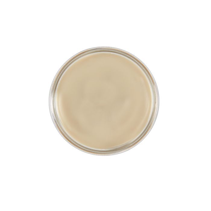 over the top look of an hair molding clay showing its cream color anad texture
