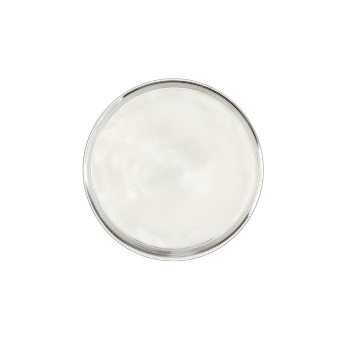 Top view of 1.7 ounce tub of Clubman Molding Paste with no lid showing its creamy white contents