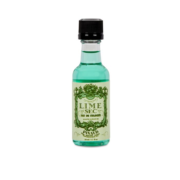 Front view of a clear 1.7 ounce bottle of Clubman Pinaud Lime Sec Eau de Cologne showing its turqoise liquid contents